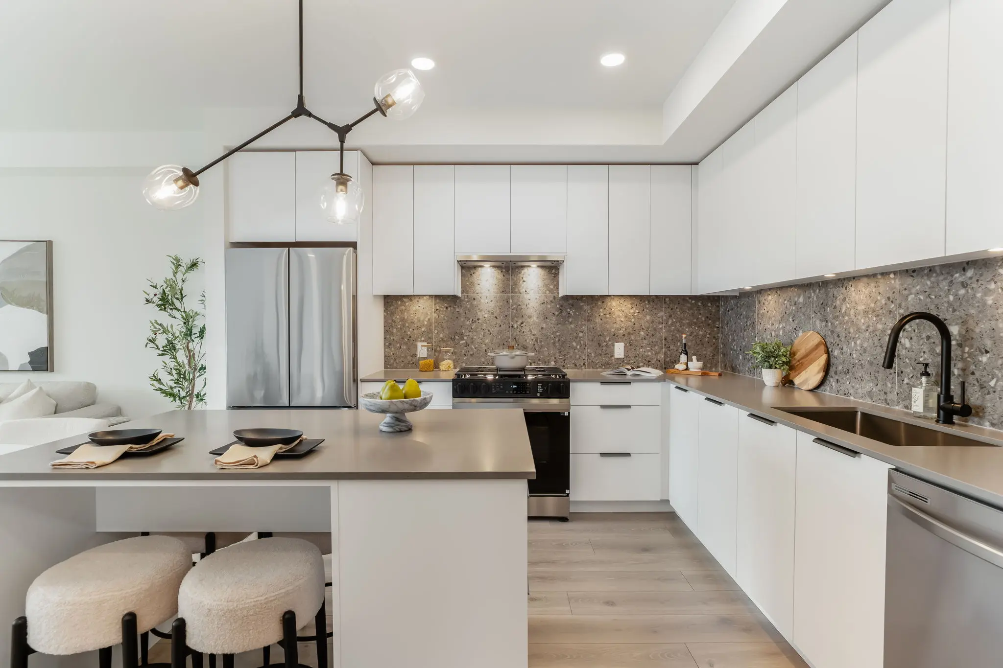Finished kitchen at The Hive 2 in Langley with white cabinets, island and stainless steel appliances